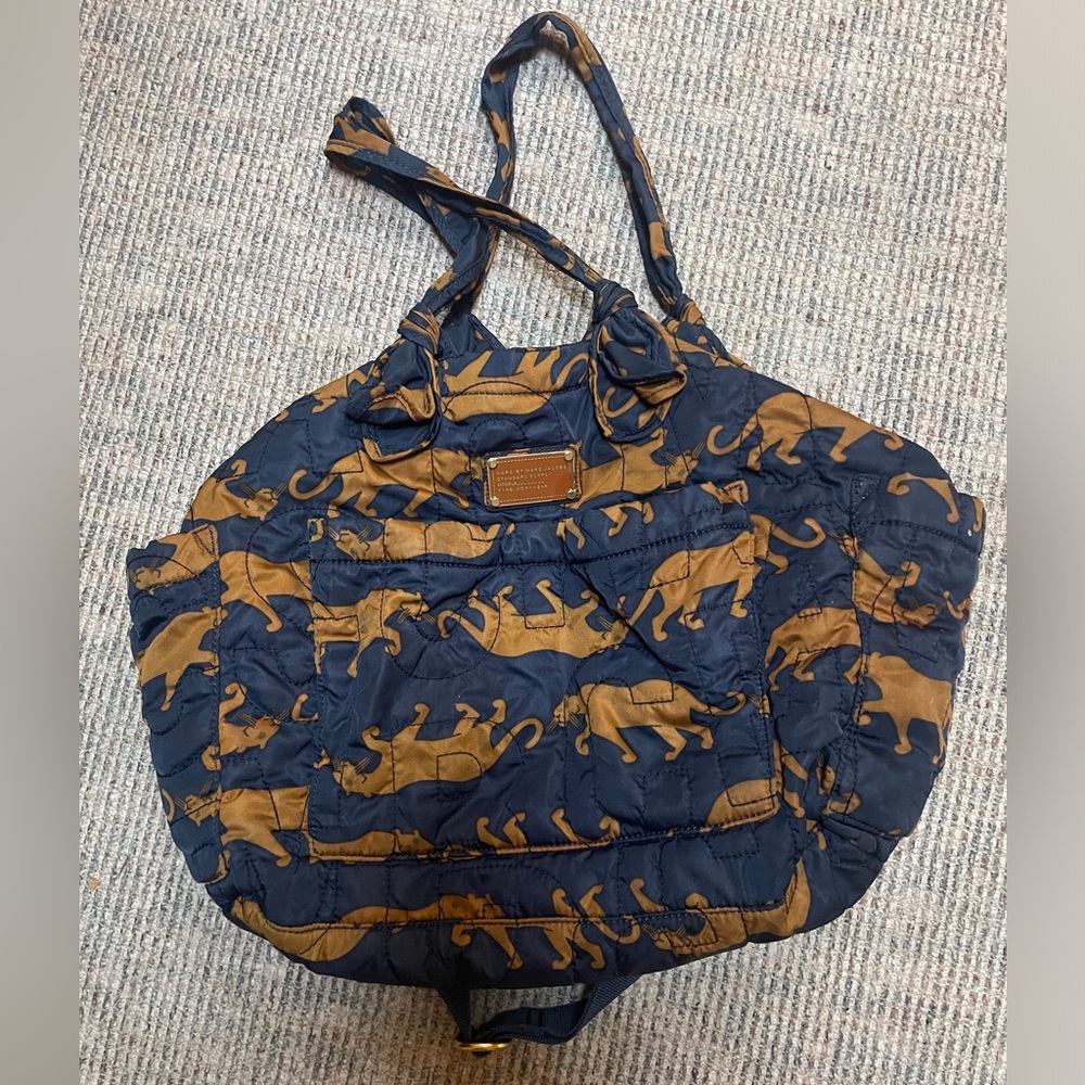 Excellent used condition. Matching changing pad and attached strap included